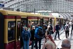 Passengers board a train at Berlin Central Station in June.