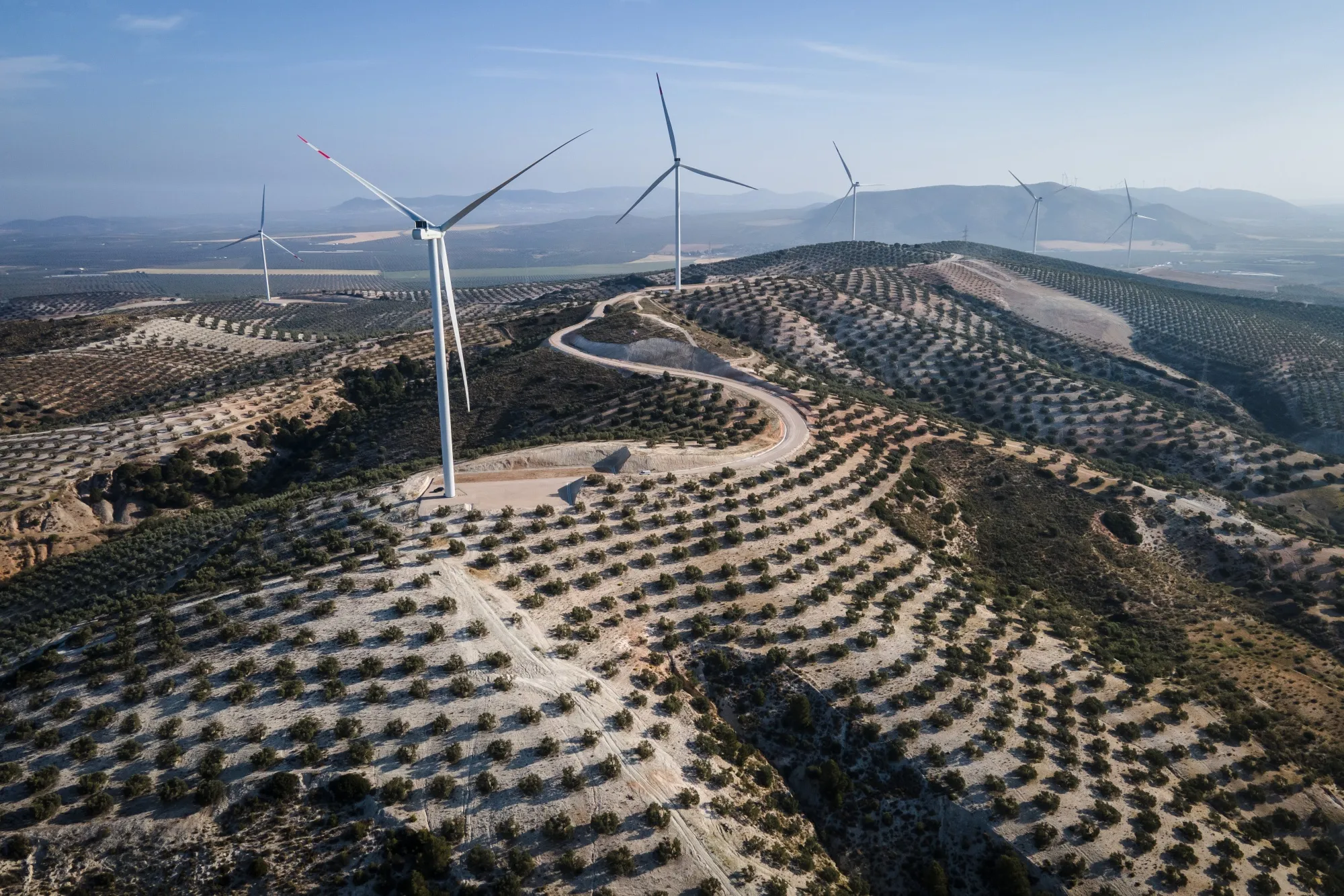 Wind turbines along the crest of a hill at the Martin de la Jara wind farm, operated by Iberdrola SA, in the Martin de la Jara district of Sevilla, Spain on April 21, 2023.