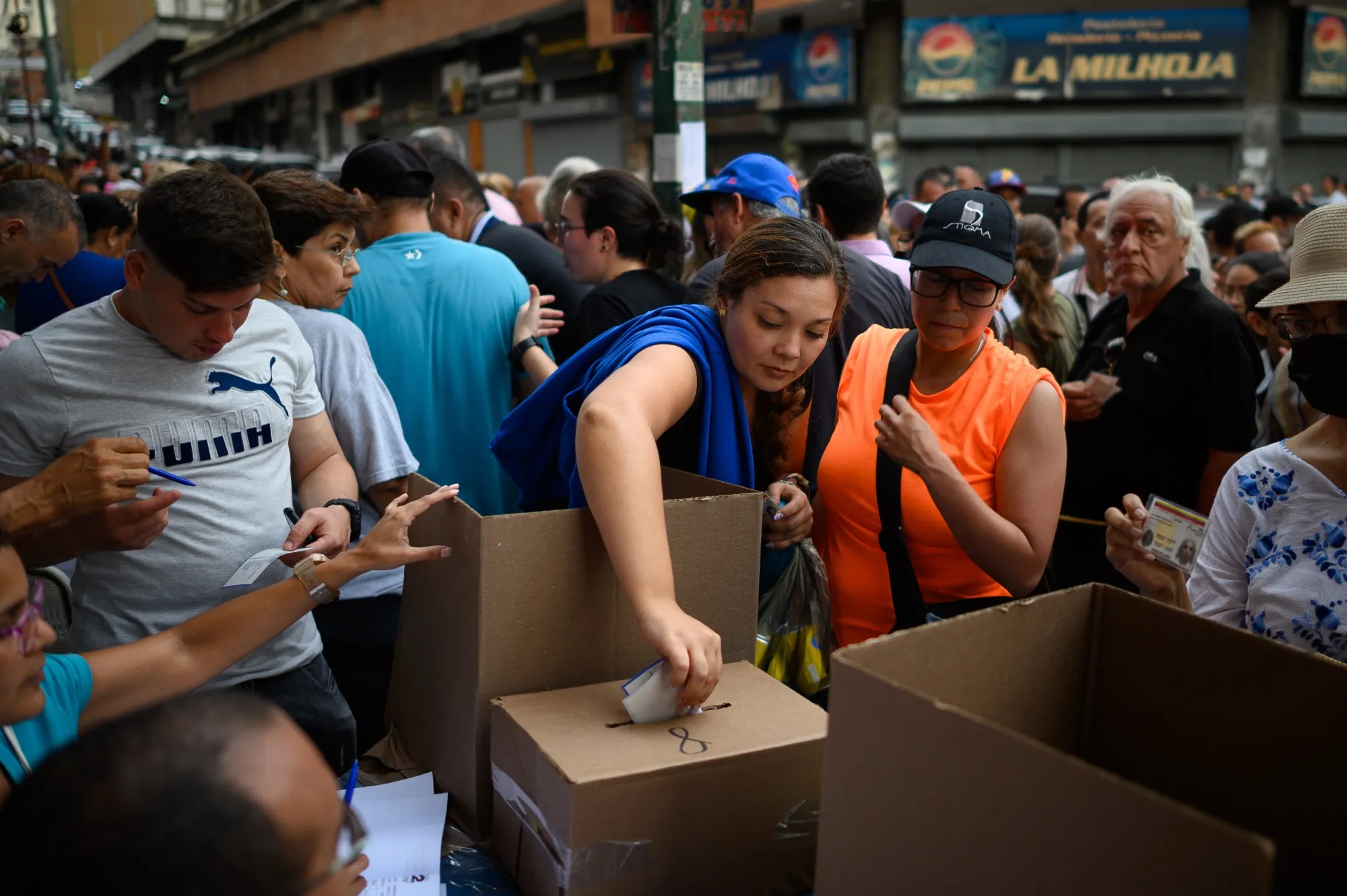 A voter casts a ballot at a polling station during the opposition primaries in Caracas, Venezuela, on Sunday, Oct. 22, 2023.