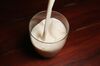 Milk produced by a2 Milk Co. is poured into a glass.