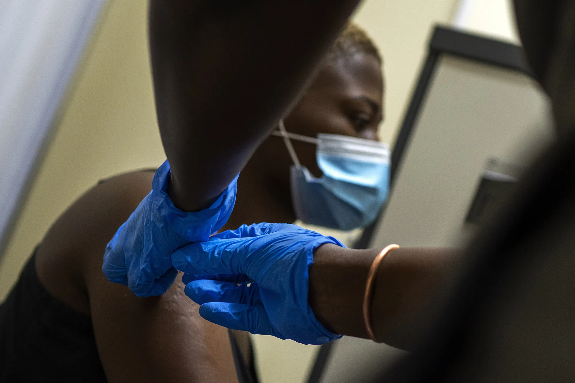 A woman receives&nbsp;a vaccine outside Johannesburg.