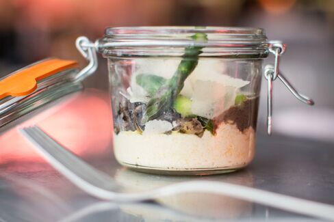 Polenta Jerusalem-style comes with asparagus, mushroom ragout, Parmesan, and truffle oil.