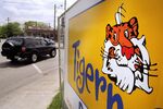 The Exxon tiger logo is shown outside a gas station under construction in Dallas, TX on April 13, 2000.
