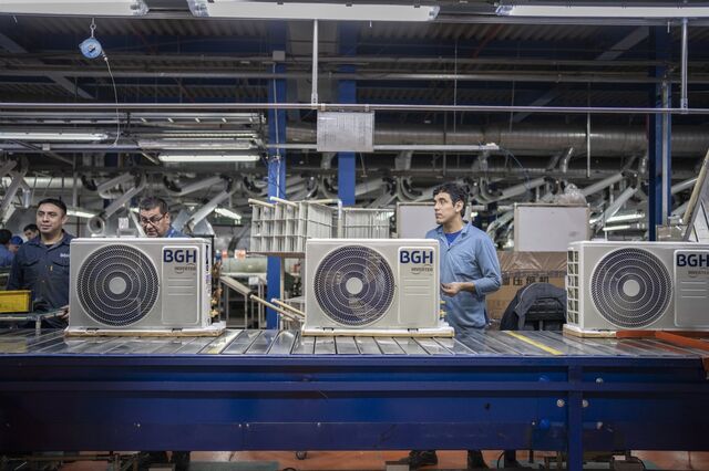 Workers assemble air conditioners at BGH factory in Rio Grande.