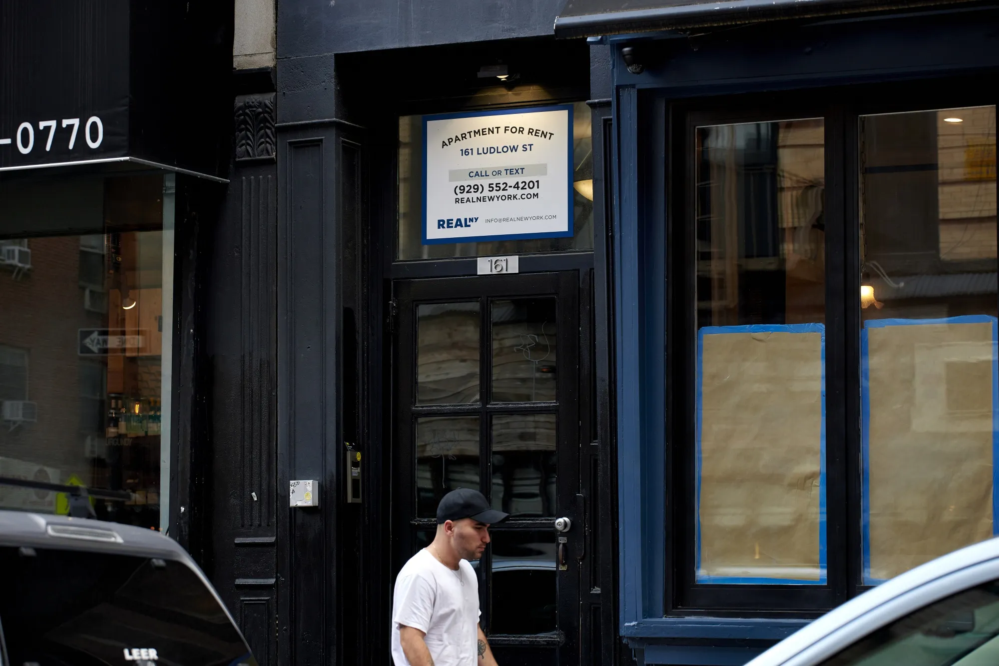 An "Apartments For Rent" sign outside of an apartment building in the East Village neighborhood of New York, US, on Tuesday, July 12, 2022.