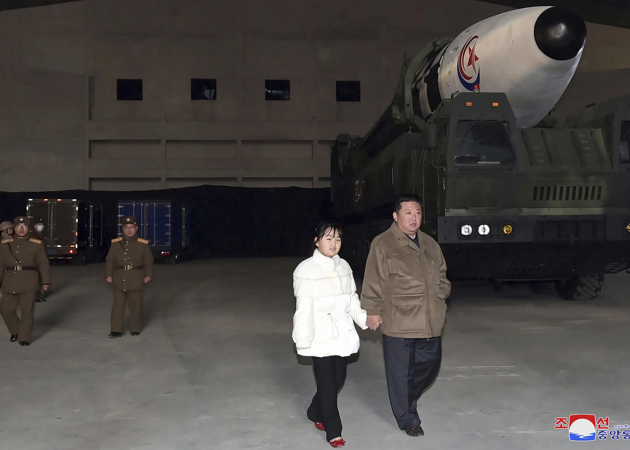 Kim Jong Un and his daughter inspect a missile at Pyongyang International Airport on Nov. 18. 