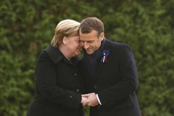 As Trump Is Grounded by Rain, Macron, Merkel Hail European Unity