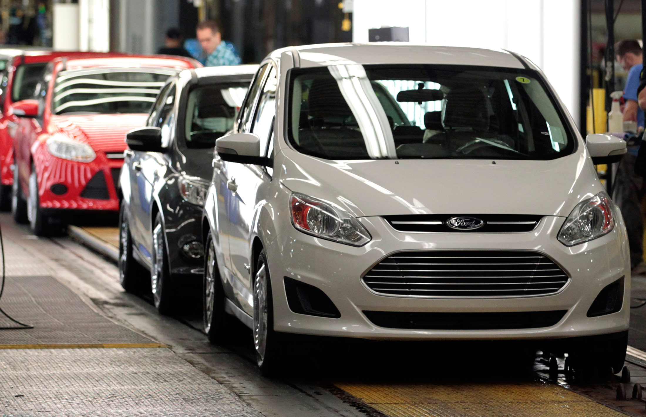 Ford Motor Co. C-Max hybrid cars reach the end of the production line at the company's Michigan Assembly Plant in Wayne, Michigan.
