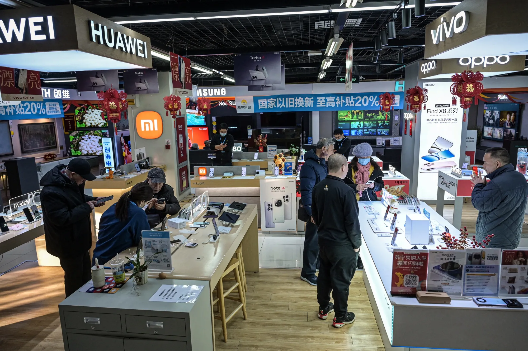 Customers at an electronics retail store in Beijing.