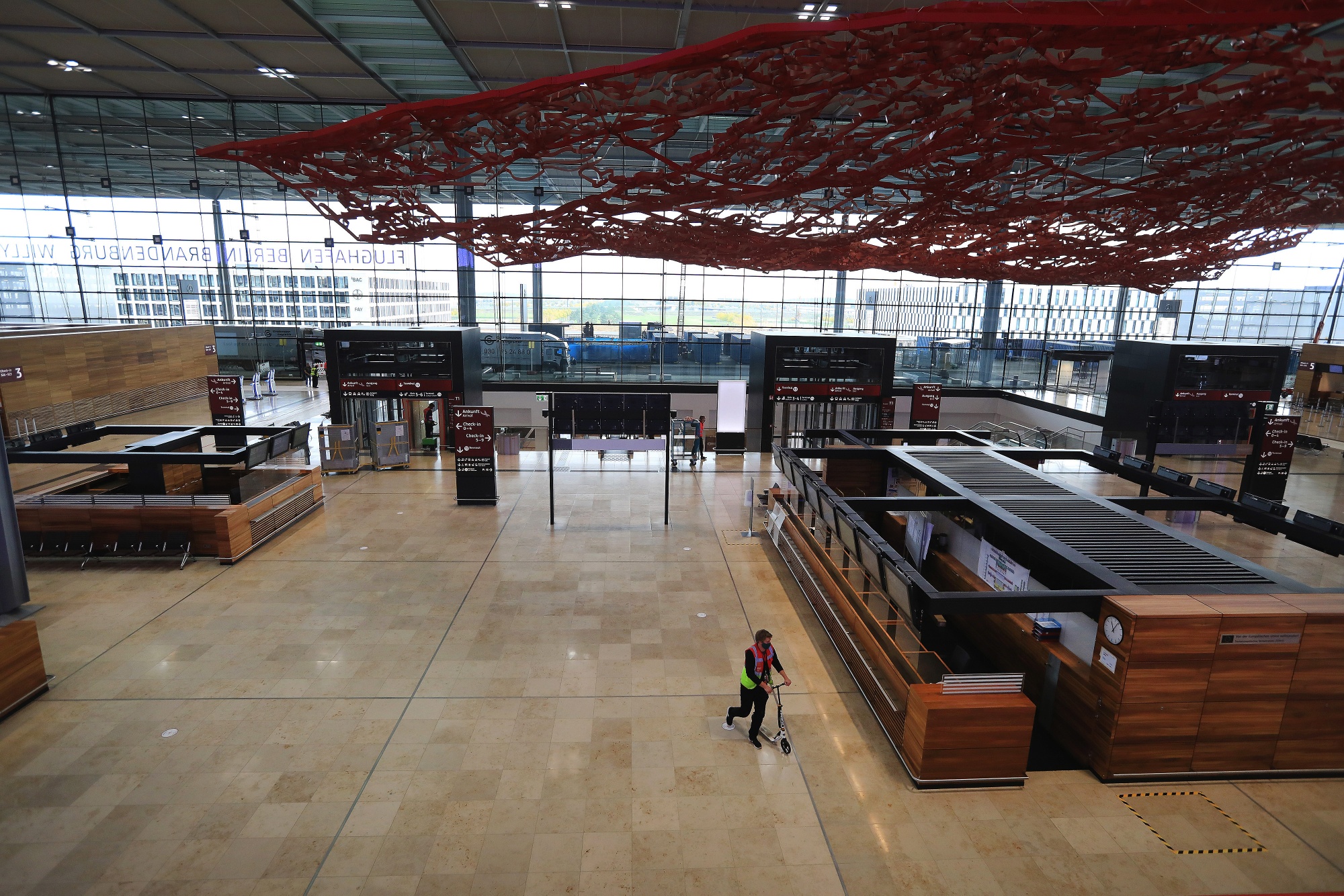 Berlin Brandenburg’s main terminal includes a giant red carpet artwork hanging from the ceiling.