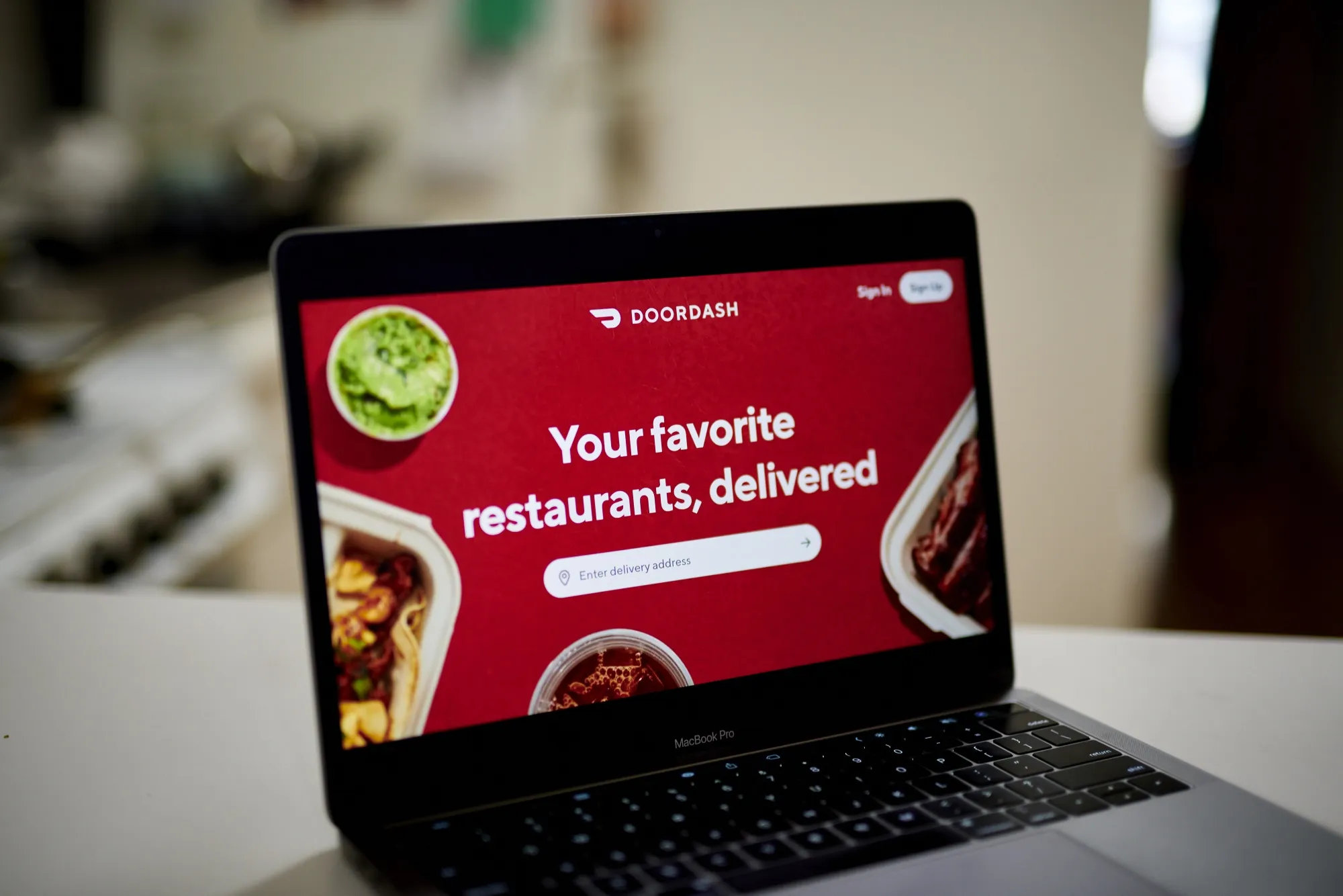 The homepage for DoorDash on a laptop computer.