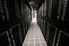 Servers and hard drives stand inside pod one of International Business Machines Corp.'s Softlayer data center in Dallas, Texas.
