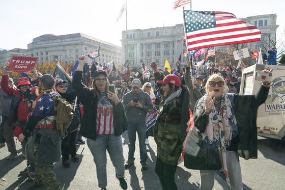 Trump Waves and Drives Past Fans Gathered to Protest His Loss