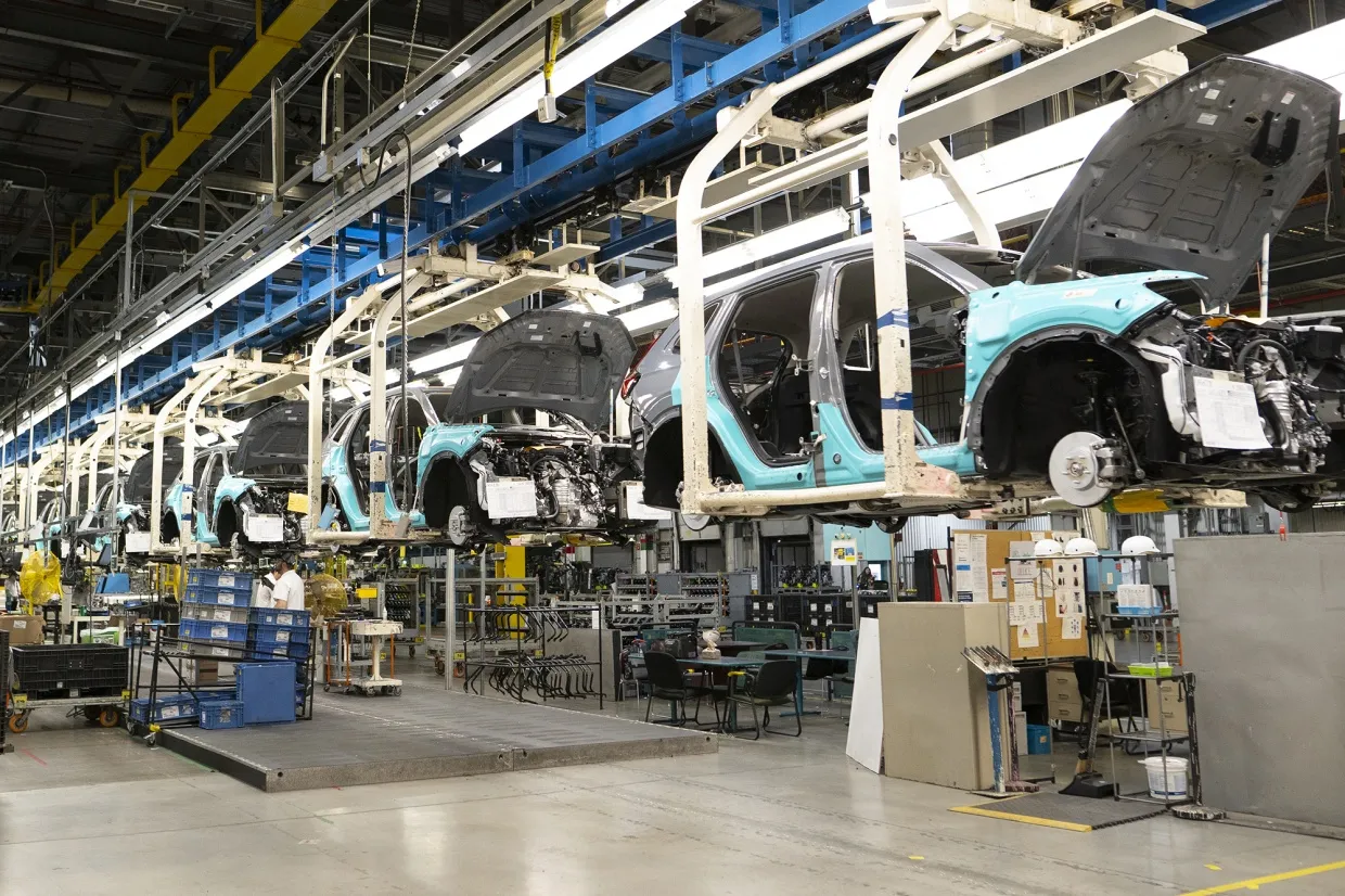 Workers on the vehicle assembly line at a Honda manufacturing plant in Alliston, Ontario.