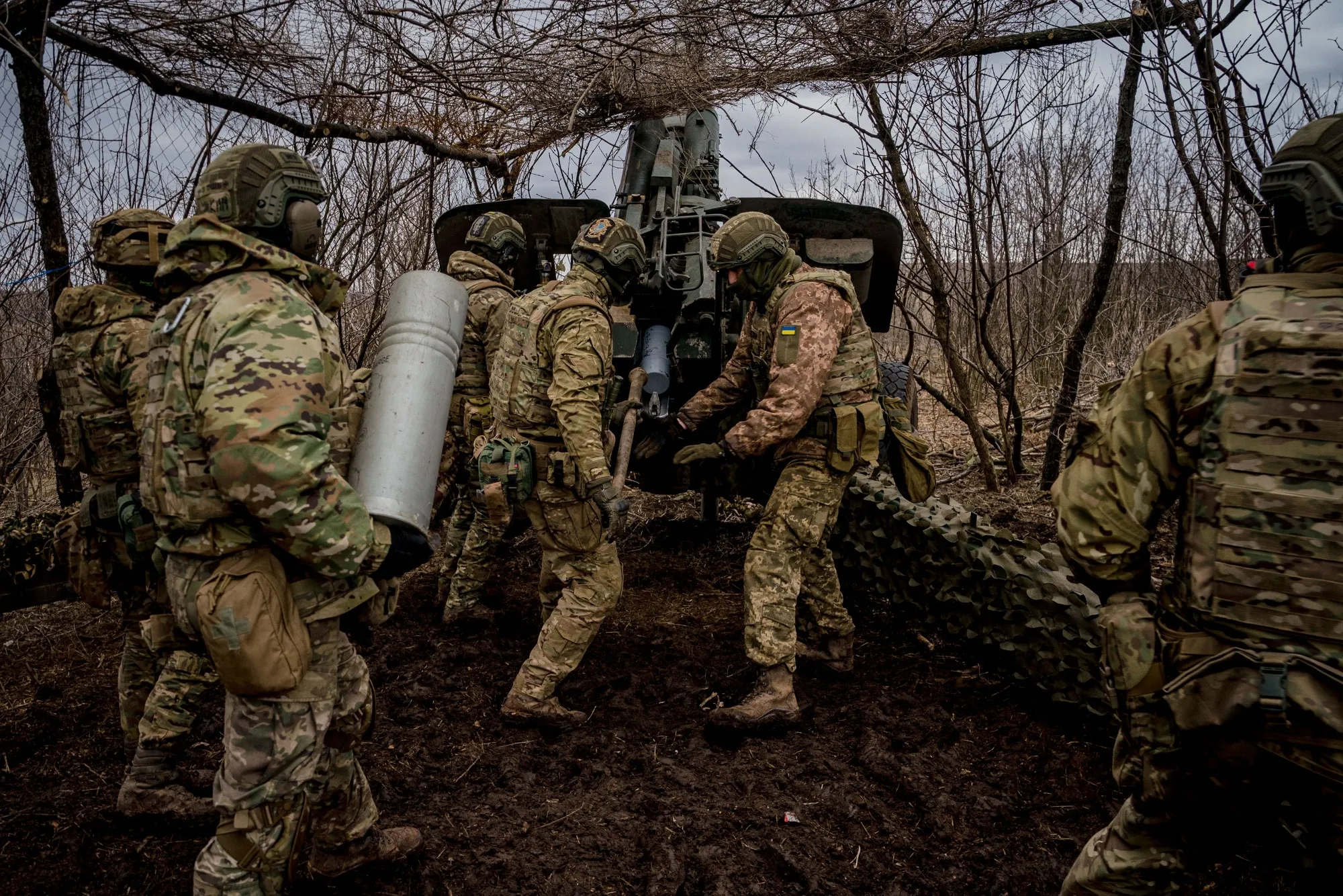 Ukrainian servicemen load a&nbsp;shell into a howitzer near&nbsp;Bakhmut, Ukraine&nbsp;on March 2.