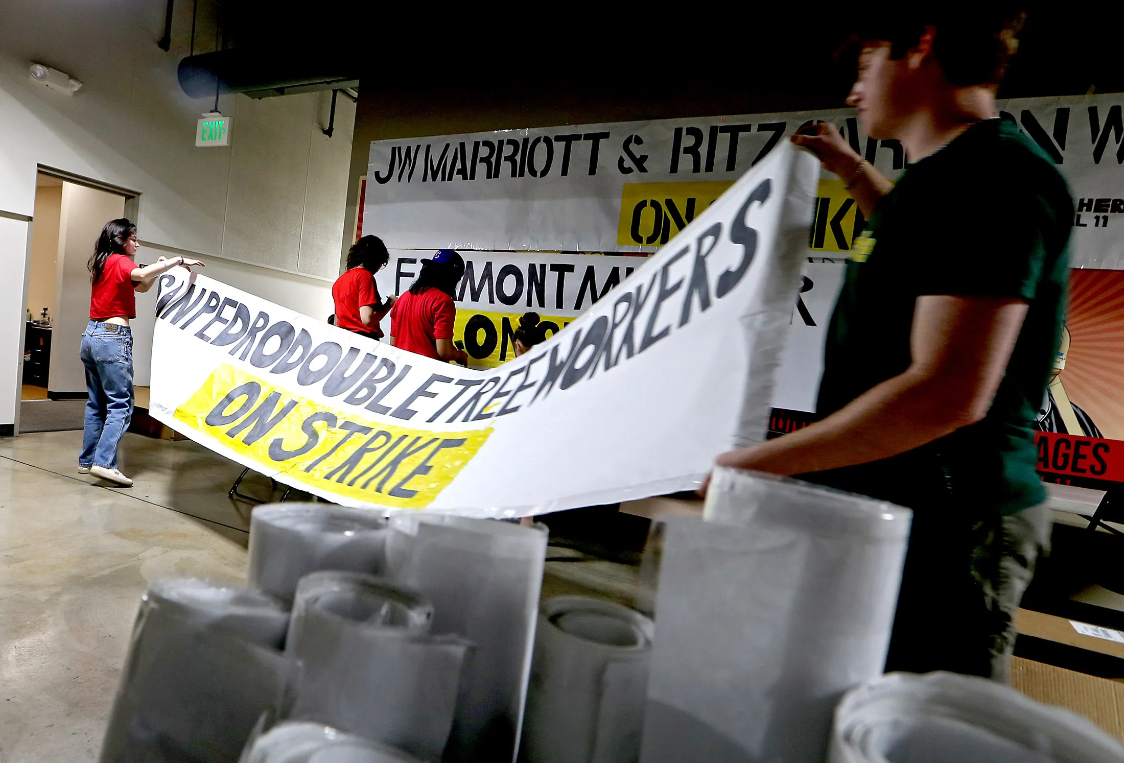 Hotel workers and union organizers create strike signs at Unite Here Local 11 headquarters in Los Angeles on June 29.