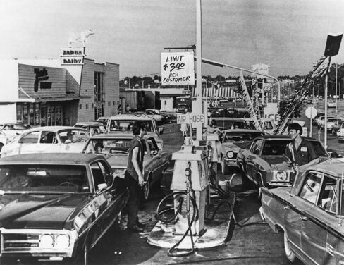 Drivers line up for fuel at a U.S. gas station during the worldwide fuel shortages caused by the oil embargo imposed by OPEC, circa 1974.