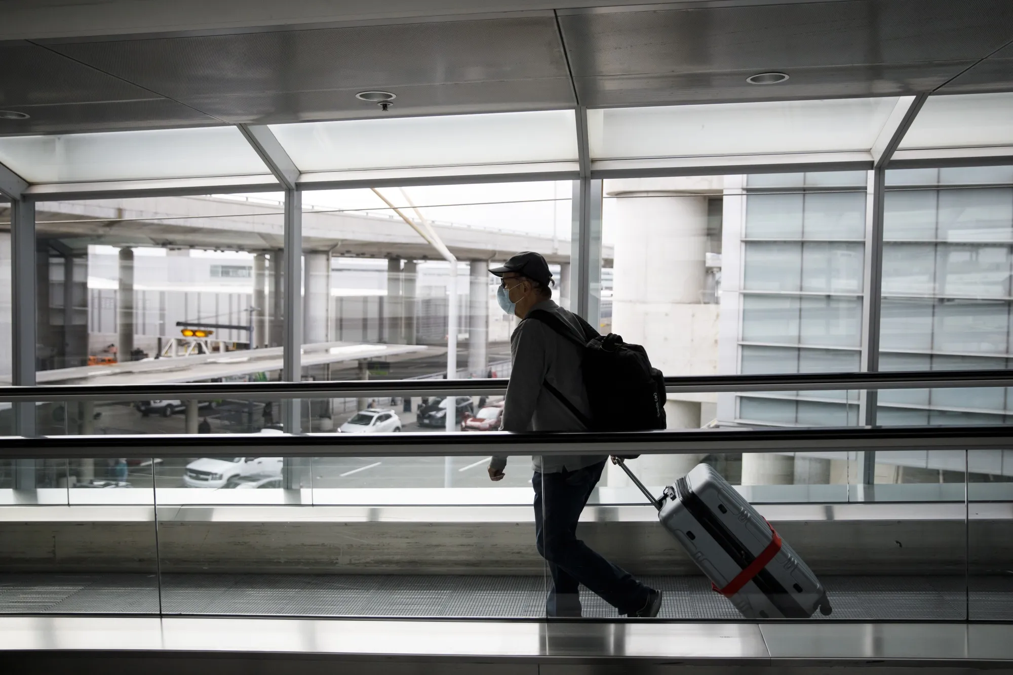 A traveler pulls luggage through Pearson airport in Toronto in October.