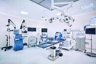 Modern hospital operating room with monitors and equipment
