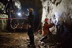 Miners work in an underground tunnel inside the OAO Alrosa diamond mine in Udachny, Sakha Republic, Russia.
