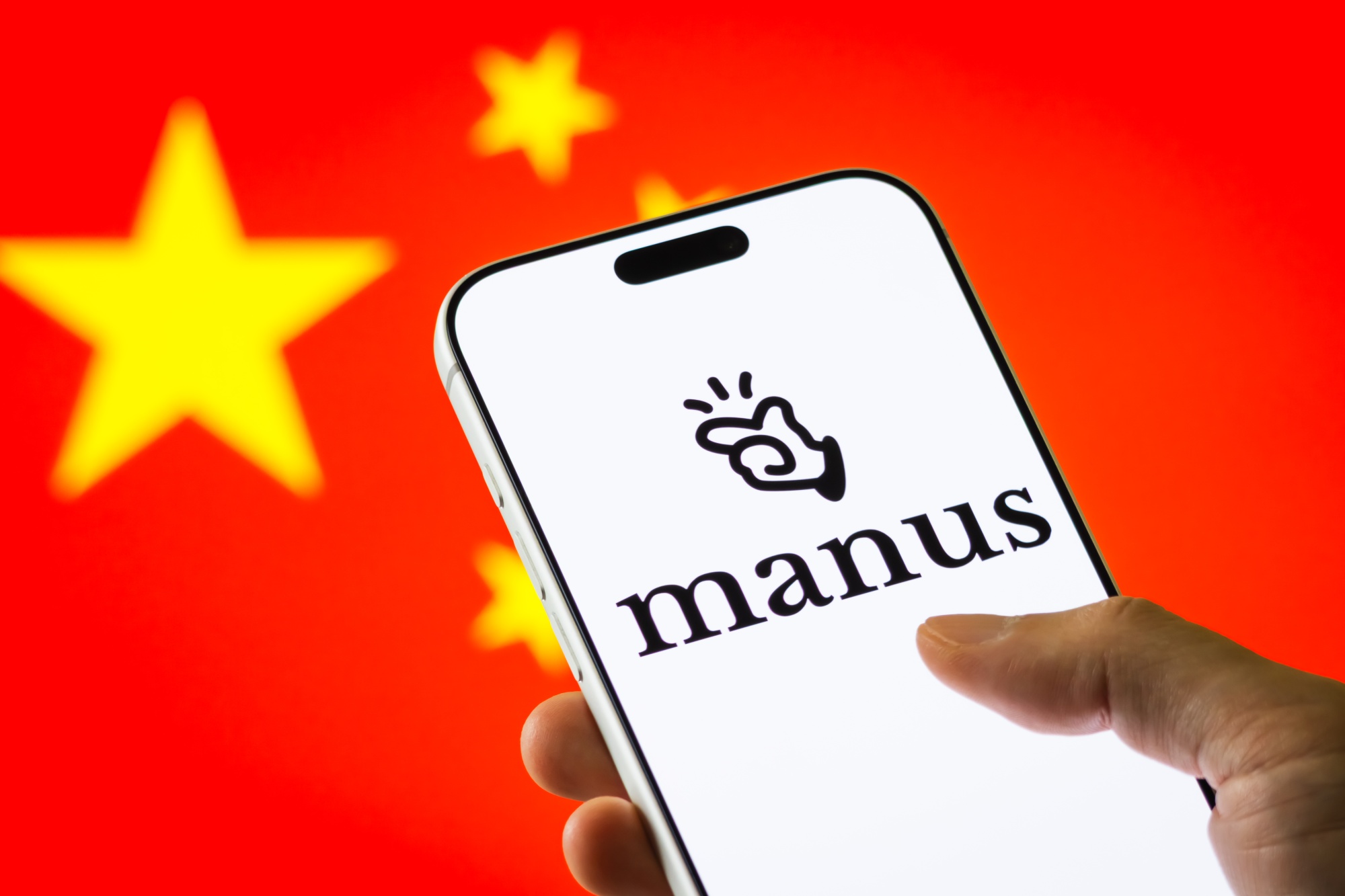 The Manus logo is displayed on a smartphone screen. Photographer: Cheng Xin/Getty Images AsiaPac