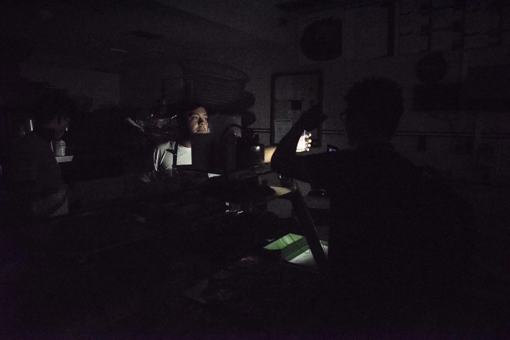 A customer buys water at a bakery during a power outage in the Chacao neighborhood of Caracas, Venezuela, on Monday, March 25, 2019.