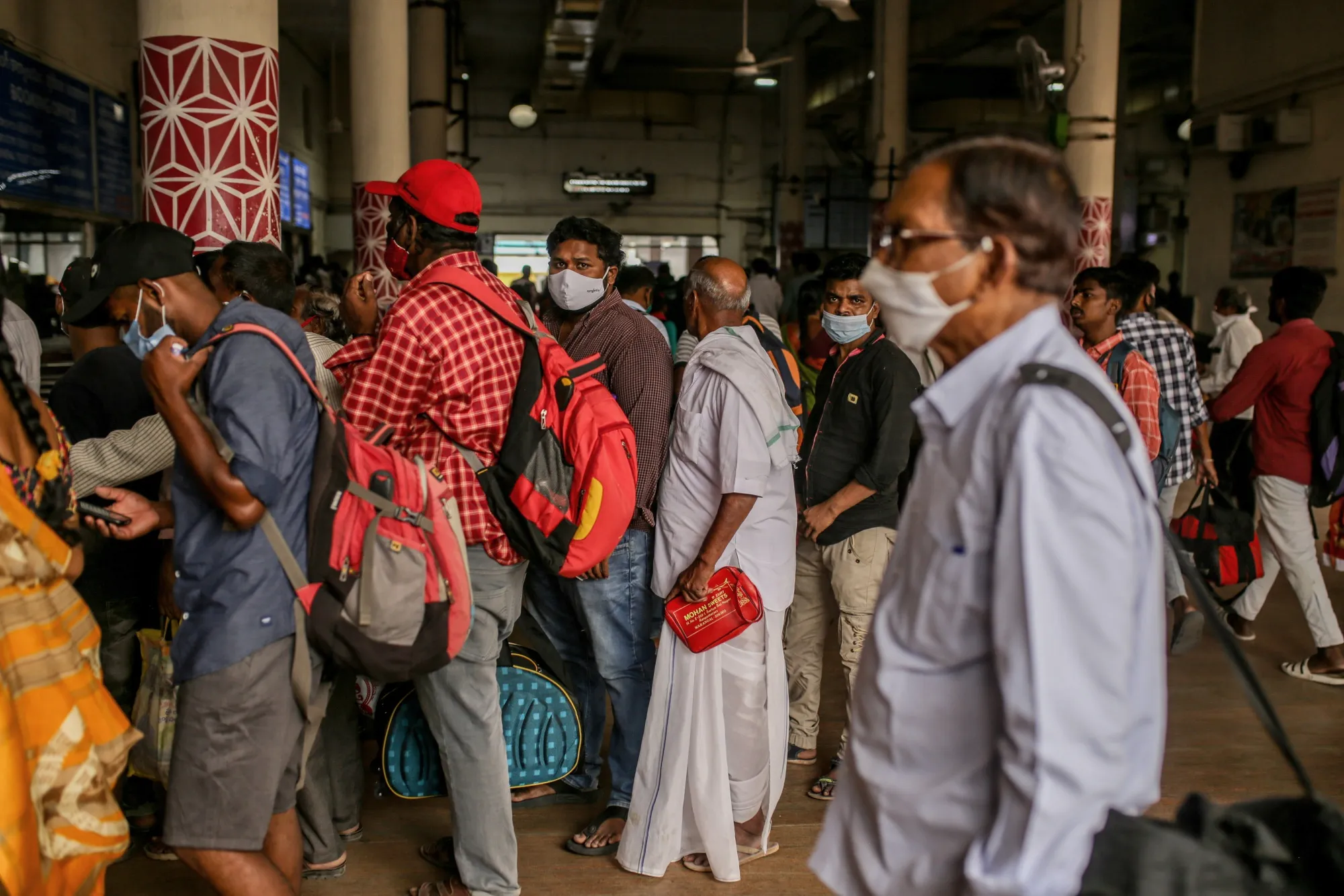 Passengers in line at the Secunderabad railway station in Hyderabad, India, on Wednesday, March 23, 2022. India’s urban consumption is driving recovery from late pandemic wave but has further intensified the divergence between cities and the hinterland, according to a report by Citigroup Inc released last week.