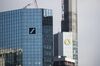The Deutsche Bank AG headquarters, left, stand alongside the Commerzbank AG headquarters in Frankfurt, Germany, on Monday, March 18, 2019. Rothschild & Co. and Goldman Sachs Group Inc. are advising Commerzbank on its merger talks with Deutsche Bank, according to people familiar with the matter.