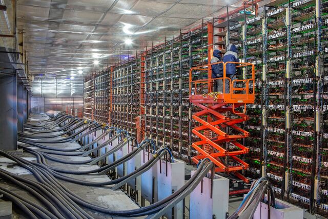 Engineers on a cherry picker inspect mining rigs at the cryptouniverse cryptocurrency mining farm in nadvoitsy, russia, on thursday, march 18, 2021. The rise of bitcoin and other cryptocurrencies has prompted the greatest push yet among central banks to develop their own digital currencies.