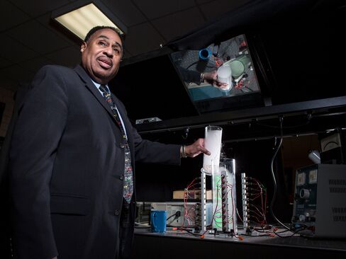 American theoretical physicist Dr. Ronald Mallett pours dry ice into a ring laser at a laboratory at the University of Connecticut on March 23, 2015.