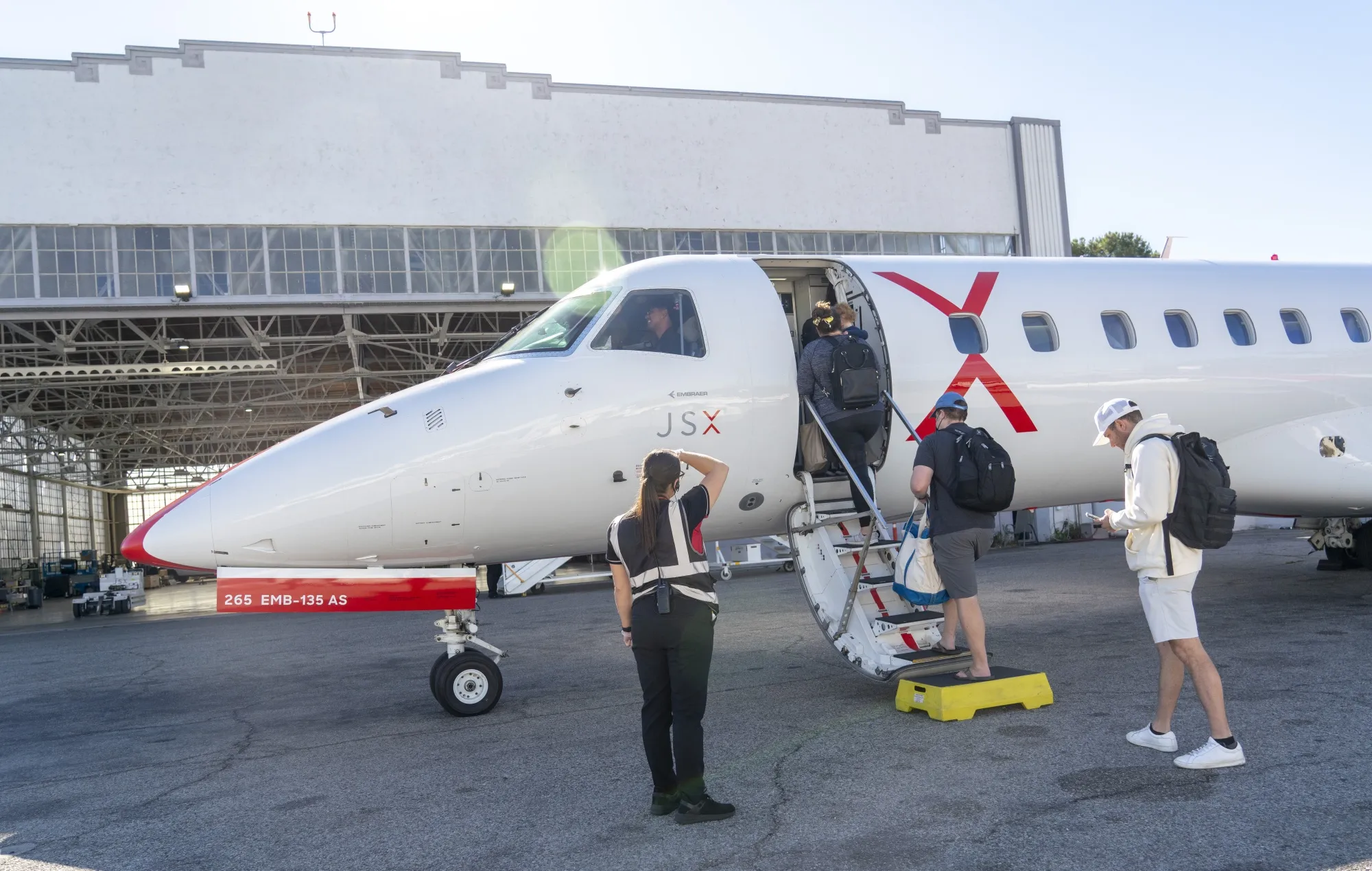 Passengers board&nbsp;a&nbsp;JSX jet at Hollywood Burbank Airport&nbsp;in Burbank, California.