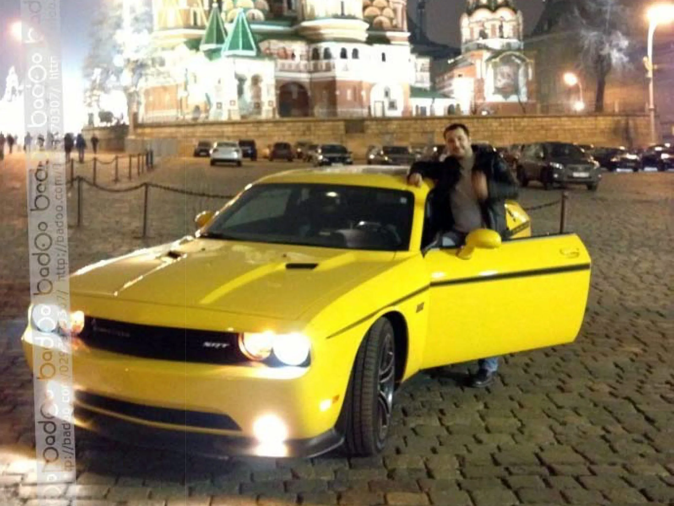 Roman Seleznev poses with his yellow Dodge Challenger SR automobile in front of the Kremlin, in Moscow, Russia, in this undated handout photo taken from his mobile phone and used in U.S. government court documents, and released to the media on March 10, 2015.
