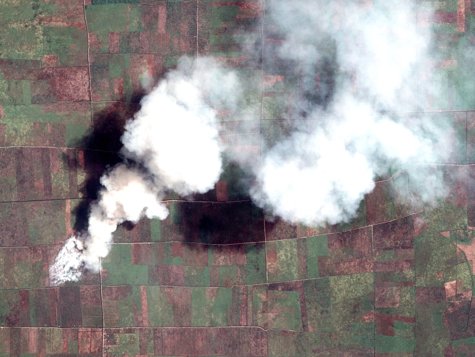 Satellite imagery captures plumes of smoke rising from a forest land fire in Sumatra, Indonesia.