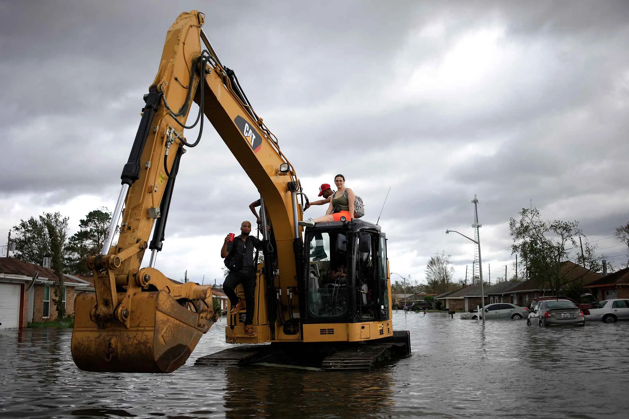 Cajun Navy volunteers drive an excavator through floodwaters left behind by Hurricane Ida in LaPlace, Louisiana,&nbsp;in&nbsp;2021.&nbsp;