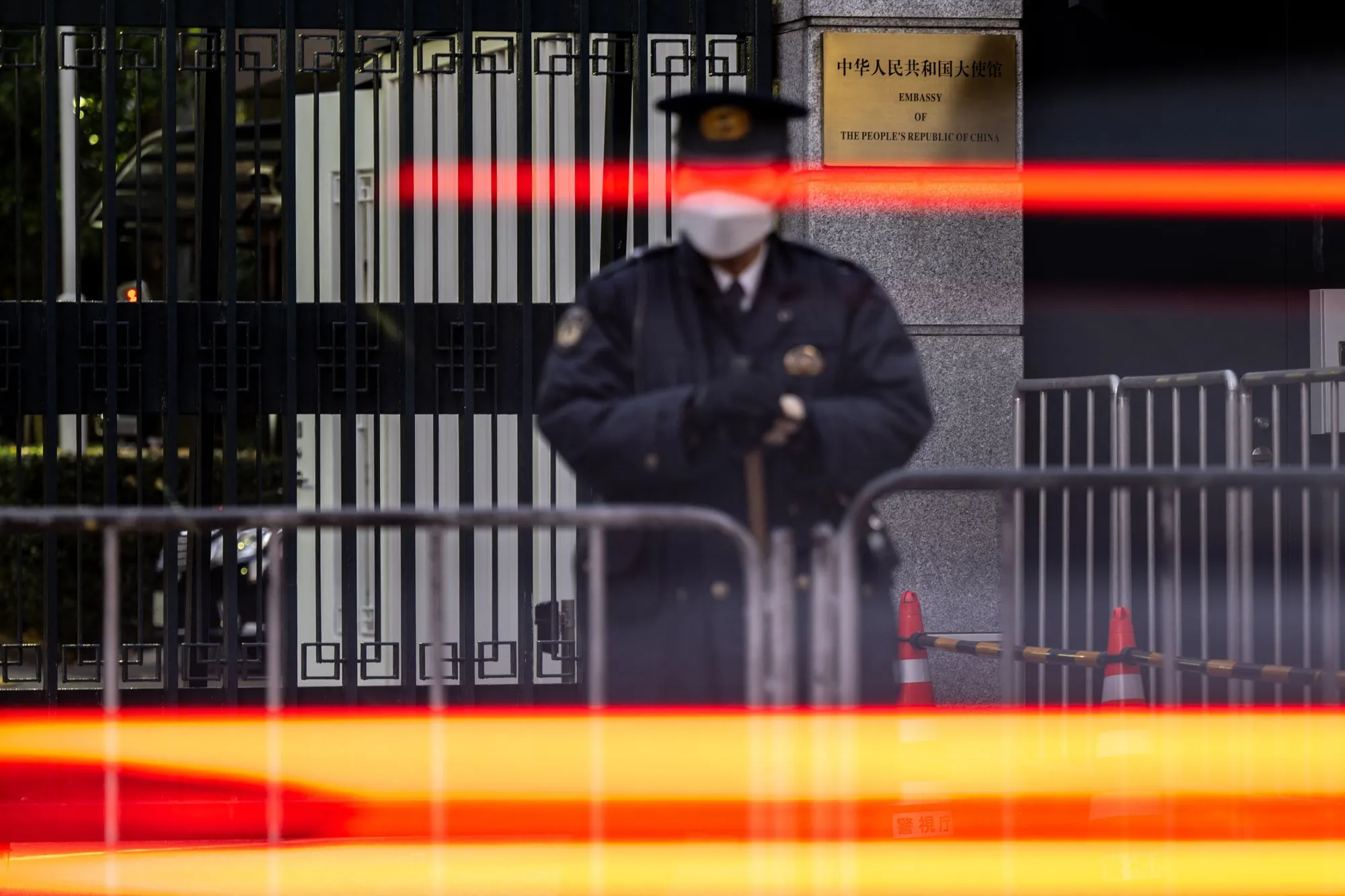A police officer stands guard outside the Chinese embassy in Tokyo.