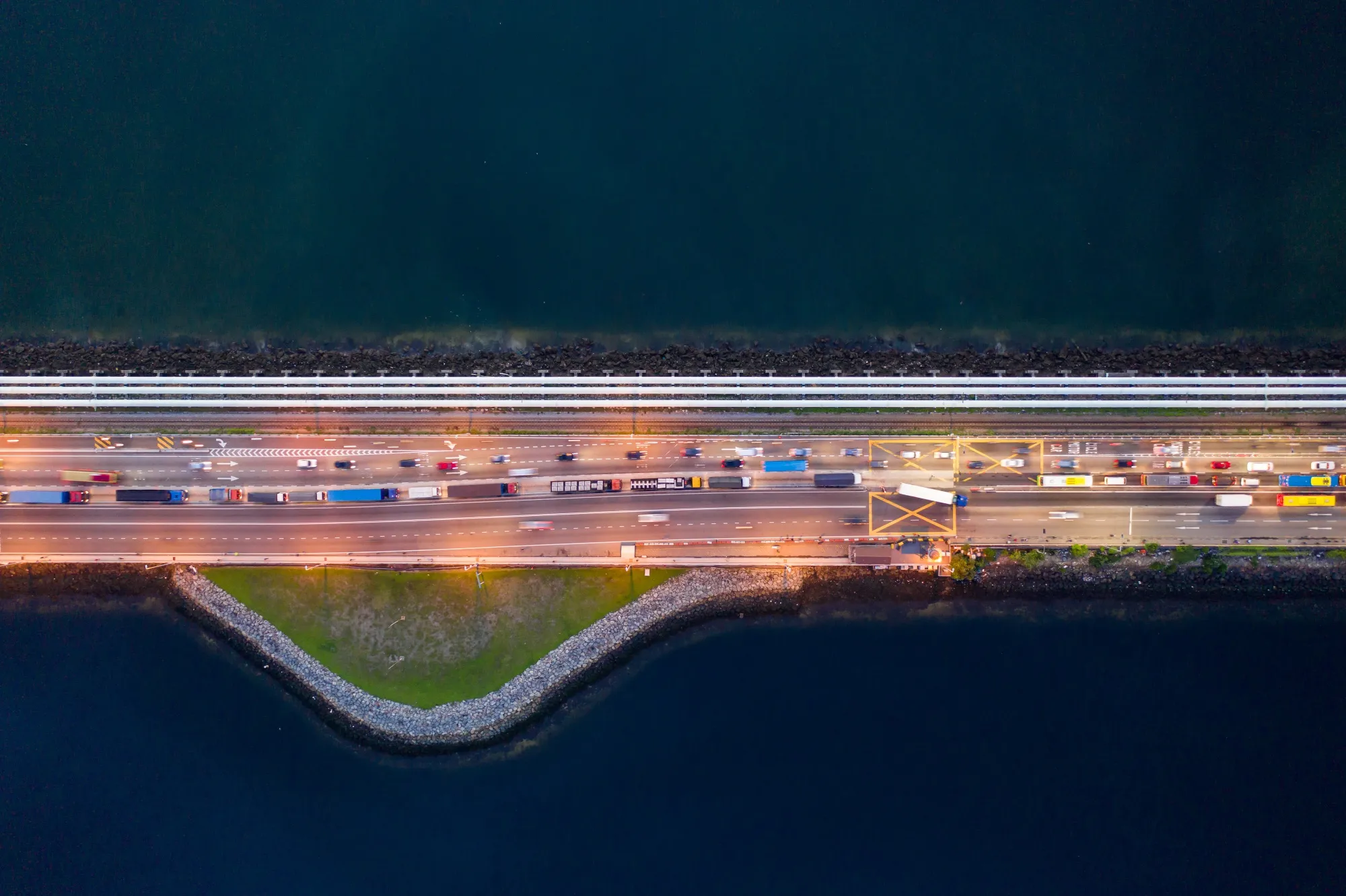 Vehicles travel along the Causeway across the Straits of Johor.