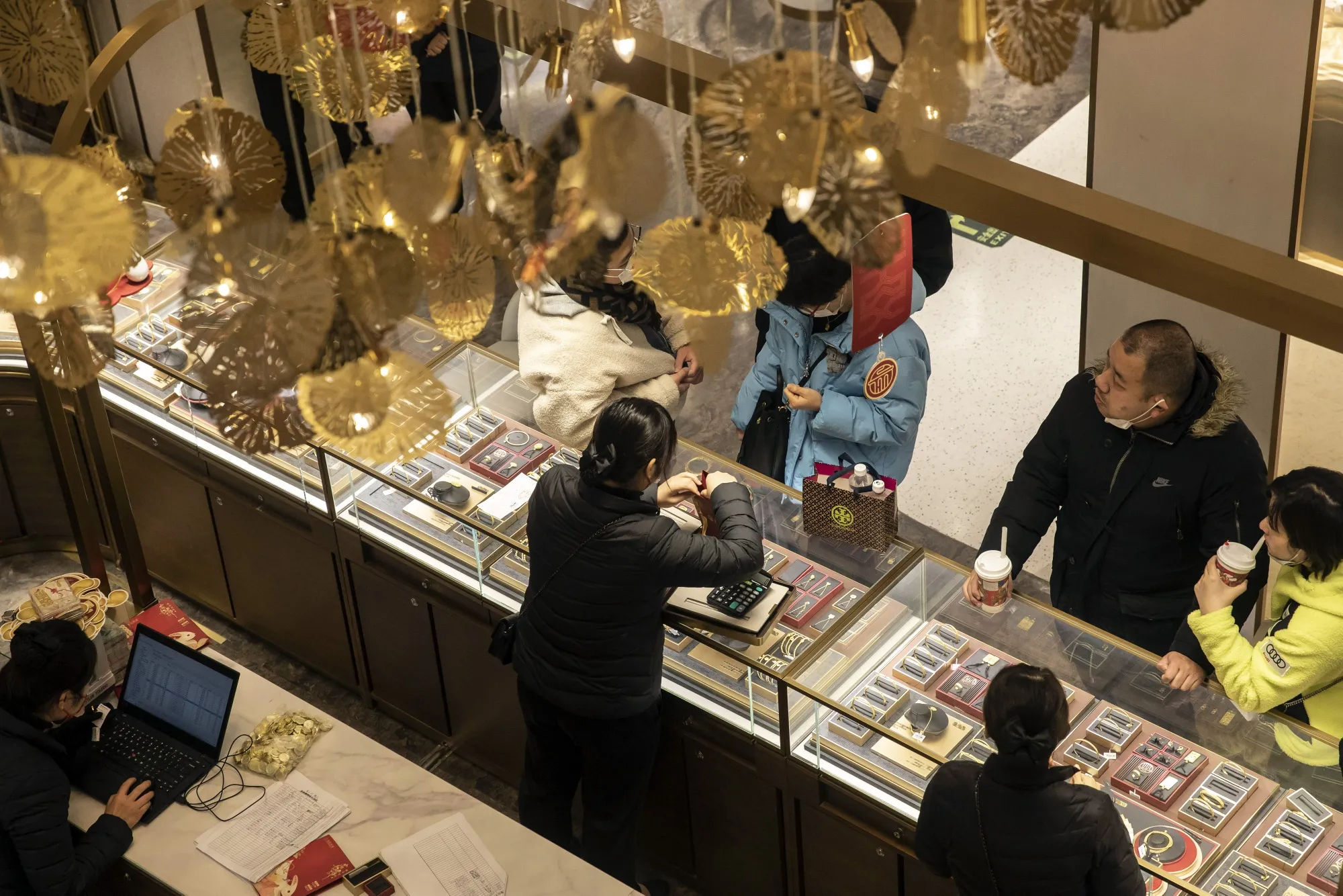 Customers at a gold and jewelry store in Shanghai.