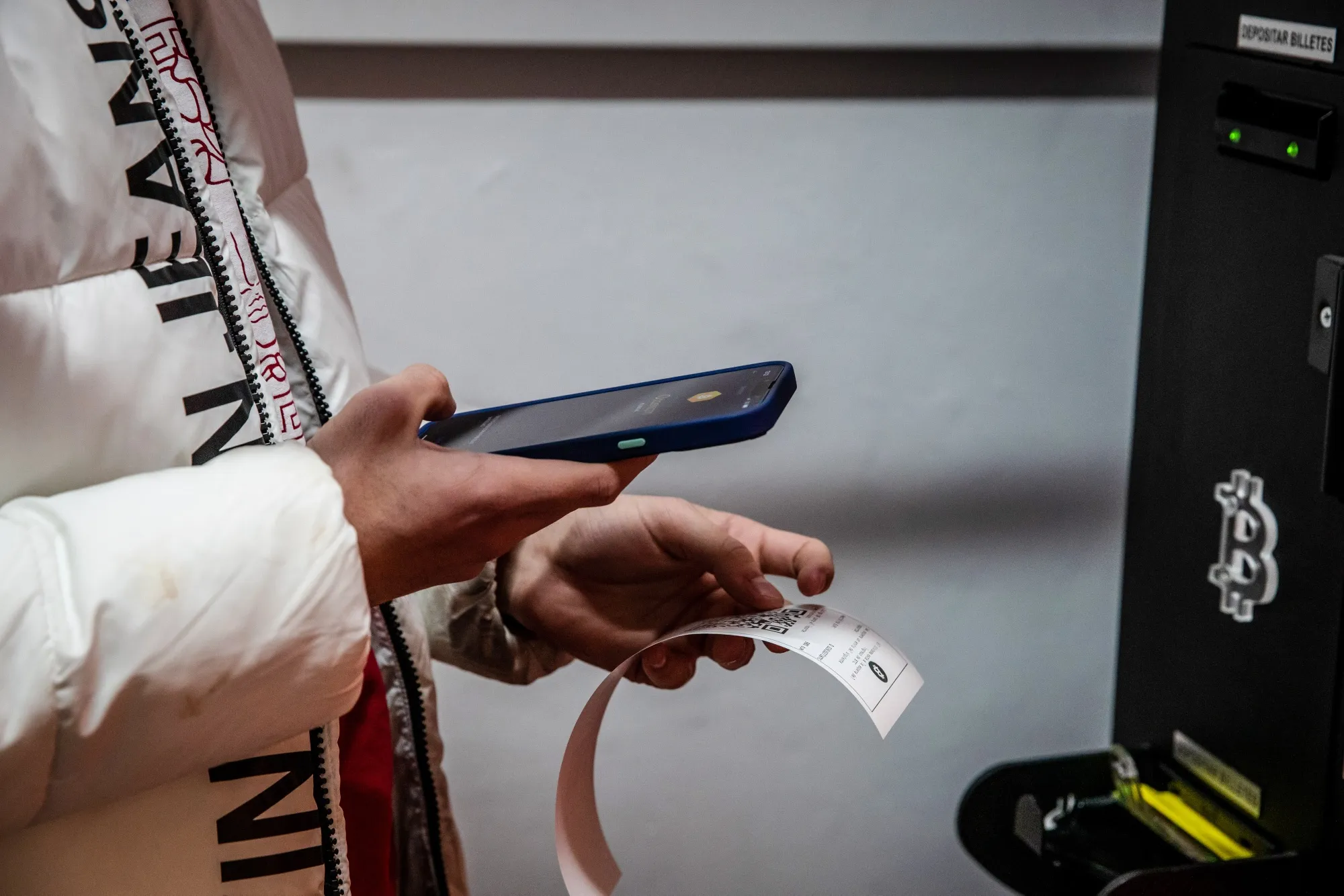 A customer scans the QR code of a purchase receipt from a Bitcoin ATM&nbsp;in Barcelona, Spain.