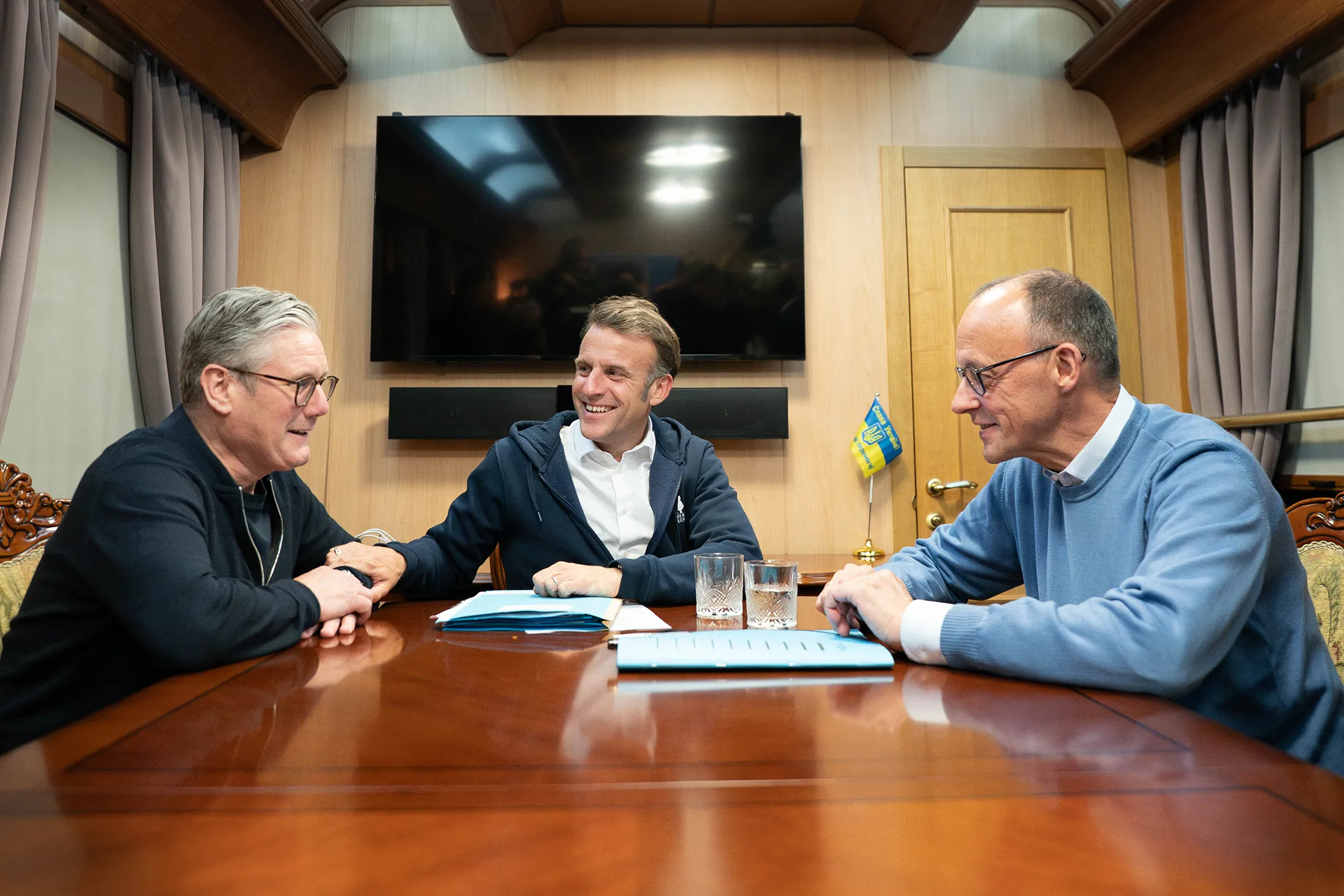 Keir Starmer, from left, Emmanuel Macron, and Friedrich Merz onboard a train to the Ukrainian capital Kyiv on May 9.