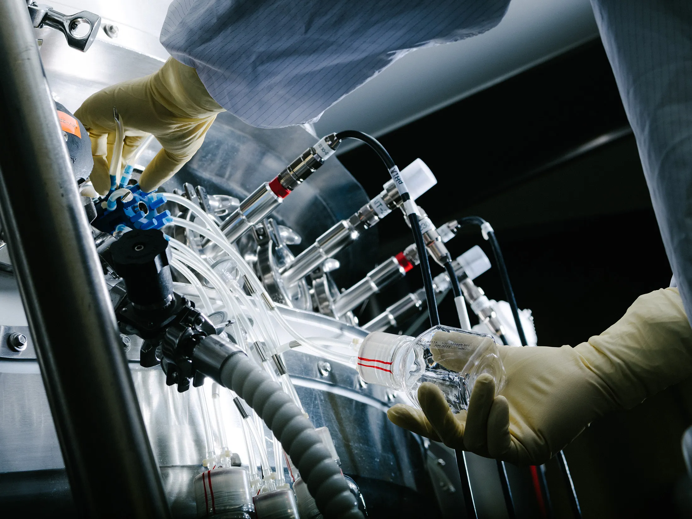 A Lilly lab technician tends to cell cultures for coronavirus antibodies.