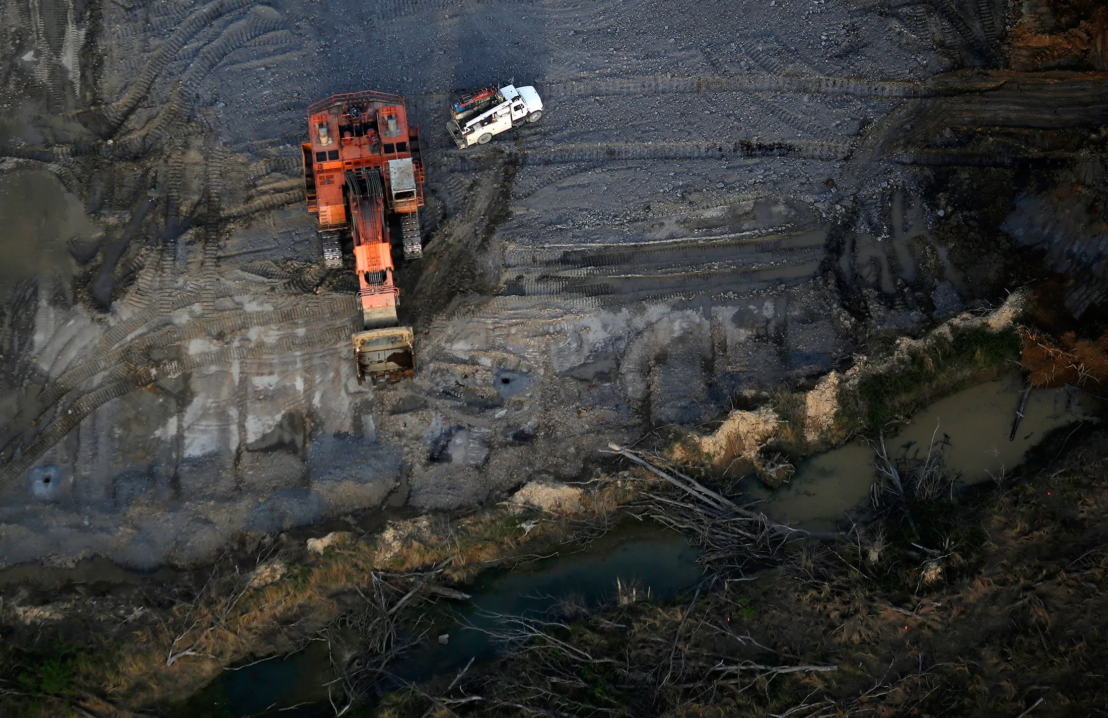An excavator stands in this aerial photograph taken above the Peabody Energy Wild Boar coal strip mine in Lynnville, Indiana, U.S., on Tuesday, April 5, 2016. Peabody filed for bankruptcy on Wednesday, the most powerful convulsion yet in an industry that's still waiting for the coal market to bottom out.
