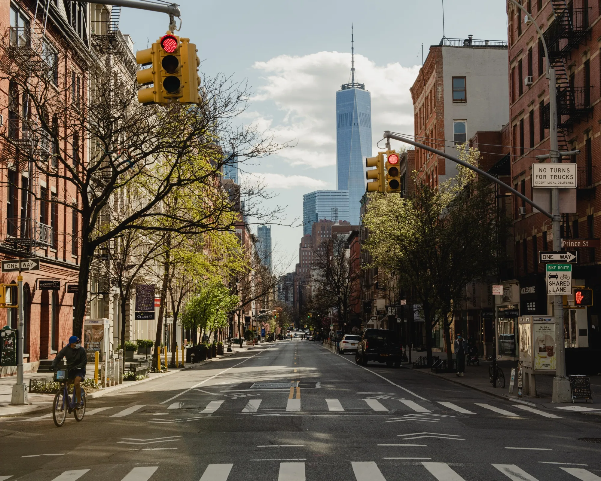 A person rides a bicycle along a nearly empty West Broadway in the SoHo neighborhood of New York on April 11.