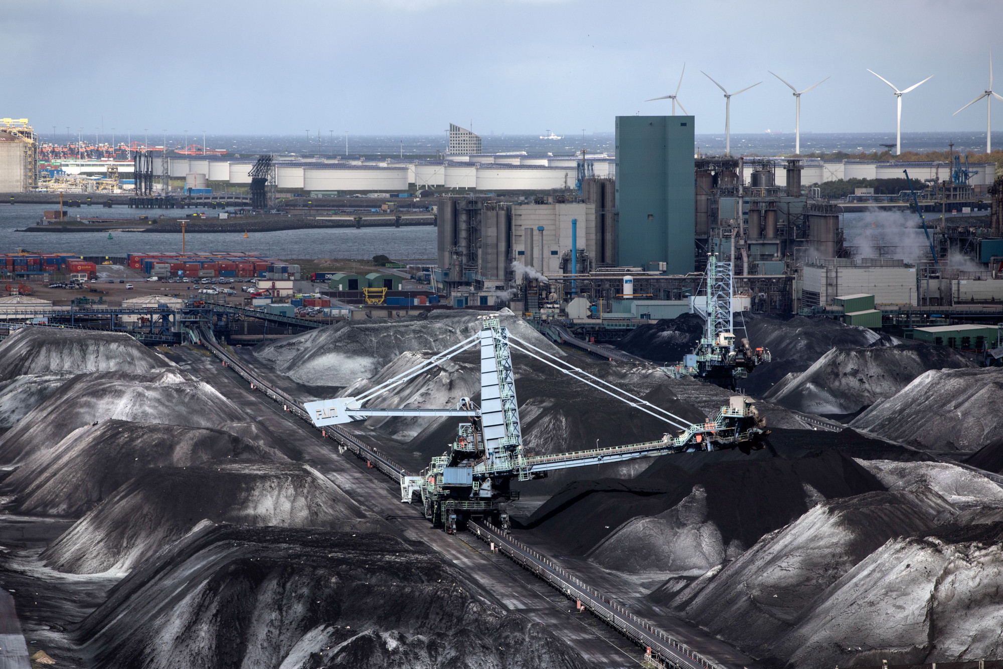 Vehicles operate at a coal storage facility at the Port of Rotterdam.
