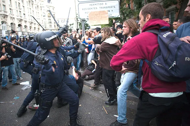 Demonstrators and police clash during a protest against the government's austerity measures in the city centre of Madrid, Spain, on Sept. 25, 2012