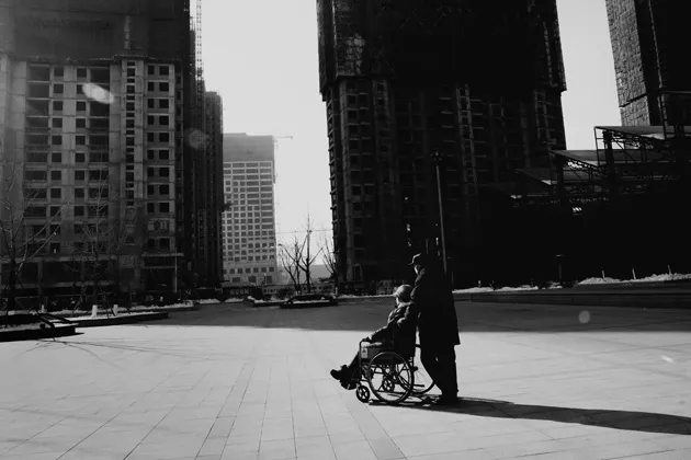 A woman in a wheelchair at a memorial park in Shenyang in China's northeast