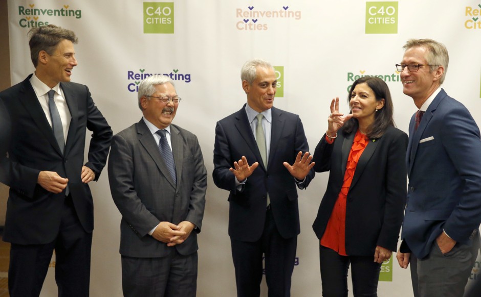 Chicago Mayor Rahm Emanuel, center, shares a laugh with fellow mayors, the late Mayor Ed Lee, of San Francisco, left, and Mayor Anne Hidalgo, of Paris, during a summit on climate change involving more than 50 mayors in December.