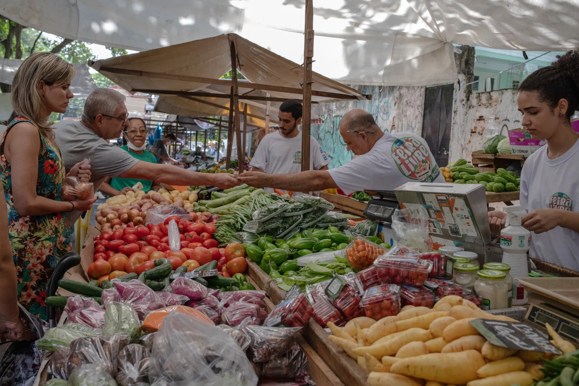 Shoppers buy produce at an outdoor market in the Tijuca neighborhood of Rio de Janeiro, Brazil.