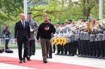 Volodymyr Zelenskiy and Olaf Scholz review an honour guard in Berlin, May 14.&nbsp;