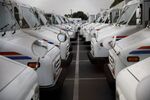 U.S. Postal Service delivery vehicles outside a post office in Torrance, California.