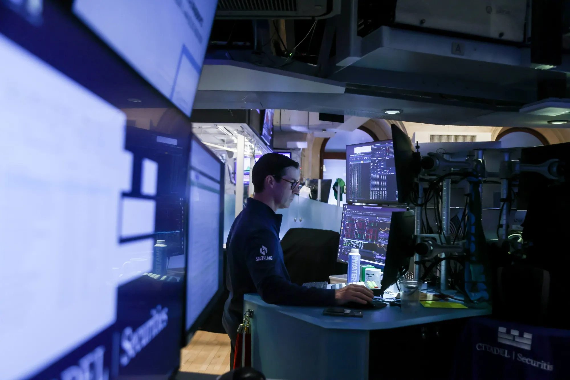 A trader works on the floor at the New York Stock Exchange.